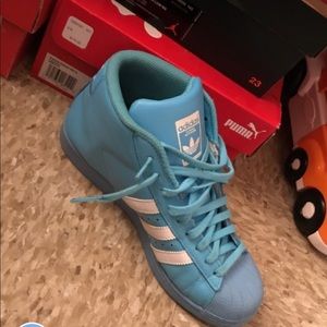 Baby blue and white adidas